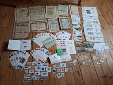 Lot actions, billets, enveloppes 1er jour, timbres, monnaies, cartes postales,..