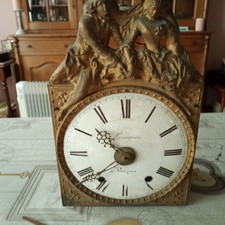 ancien mouvement de comtoise  emaillé avec son balancier et ses poids