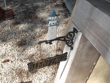 jolie plaque bienvenue fer forgé avec phare de marine à fixer en applique