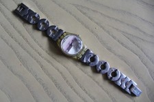 JOLIE PETITE MONTRE SWATCH. SQUELETTE. ANNEES 70'S. CADRAN BAYADERE.  DANS ETUI.