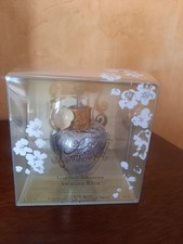 lolita lempicka:f eau de parfum 30ml  vide collector avec fleurs métal blanc ,or