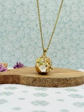 Bola de grossesse doré décor fleurs & abeille – bola musical apaisant