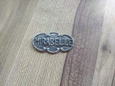 Ancienne étiquette de bouteille en étain " Mirabelle  "