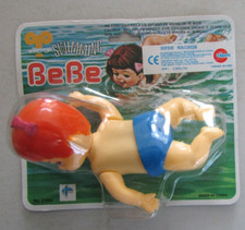 Ancien jouet de bazar à remontoir Bébé nageur Swimming Action baby Neuf 3 ans+