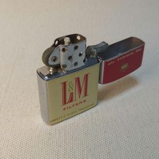 Ancien briquet à huile AD L&M