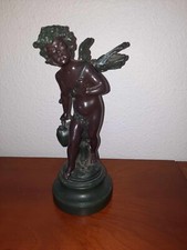 Chérubin, enfant au cartable en résine patinée par Auguste Moreau