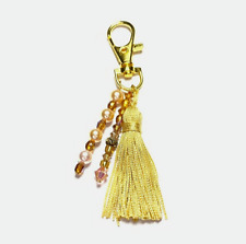 Bijou de sac doré Pompon à fil rayonne couleur vanille et perles en verre