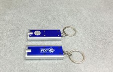 PORTE CLEF CLES LAMPE FRANCAISE DES JEUX VELO CYCLISME CARAVANE TOUR DE FRANCE