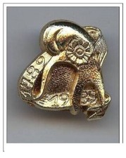 fève métal doré -