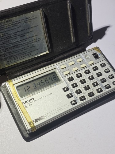 Electronic calculator clock - calculator,