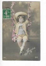 CARTE FANTAISIE  ENFANT GARCON SUR UNE BALANCOIRE