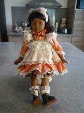 POUPEE METISSE EN PORCELAINE