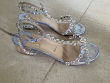 SANDALES ARGENTÉES CHRISTIAN