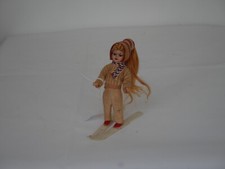 Poupée d'une jeune skieuse en celluloïd