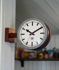 Horloge murale double face