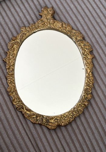 Miroir mural ovale doré