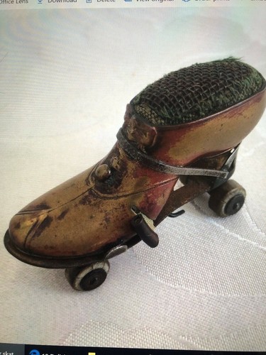 Antique brass roller skate - antique,