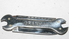 canif en forme de clé à