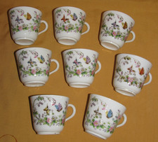 8 tasses anciennes porcelaine fine Paris Limoges décor floral papillons XIXème