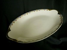 Grand plat ovale en porcelaine de Limoges E. Madesclaire 1906 