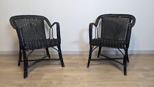 Paire de fauteuils noirs en
