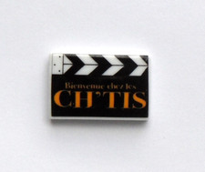 cyb - Fève Clap de cinéma film Bienvenue chez les Ch'tis -WB