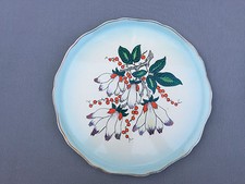 Ancien plat rond en porcelaine