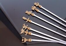 Hâtelets / Ensemble de 7 piques à brochettes en laiton