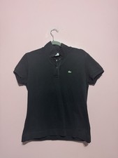Polo Lacoste noir  Femme taille 42 en très bon etat 