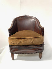 fauteuil club art déco assises tissus dossier recouvrement cuir . XX siècle .