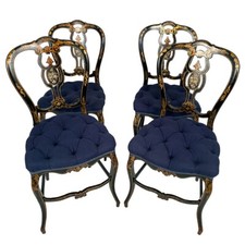 Série de quatre chaises en bois laqué noir burgauté et décor or, Napoléon III