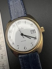 Montre vintage 1970s Ambre France mécanique date plaqué or 33mm femme homme