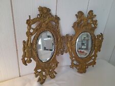 Paire de miroirs en bronze anciens à décor d'angelots, miroir biseauté
