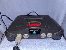 Nintendo 64  + 8 Jeux en loose + accessoires . ( voir descriptif de l annonce )