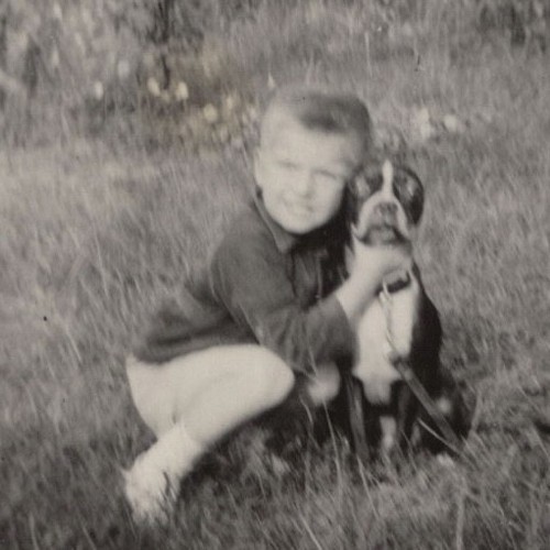 1950s boy hugging - dog, happy