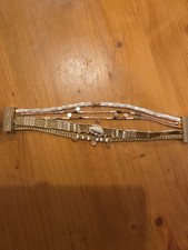 Bracelet Hipanema doré perles