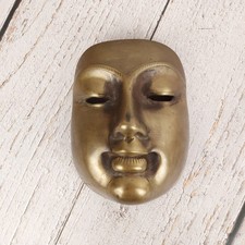 Masque vintage mural en laiton