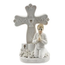 Praying communion boy by a