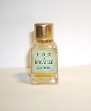 très ANCIENNE miniature parfum :  FLEURS de ROCAILLE de CARON  ** PLEINE **