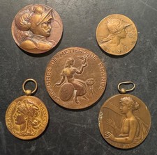 5 médailles Br " Rivet 1899 -