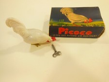 Jouet mecanique GEGE :PICOCO le coq qui picore en marchand