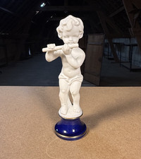 Statuette enfant joueur de