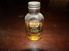Ancienne petite bouteille vaseline blanche merev ( cycles , armes , machine à .)