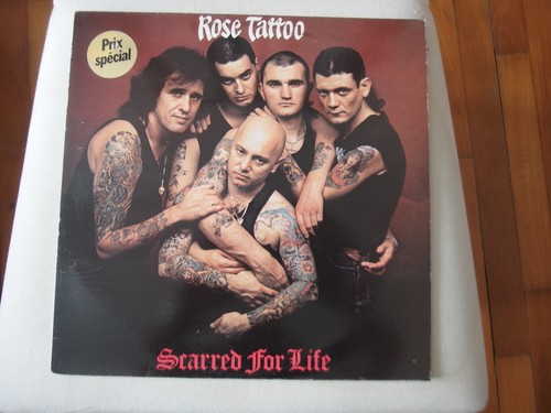33t rose tatoo scarred - -,