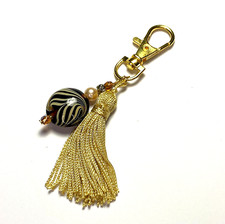 Bijou de sac doré Pompon à