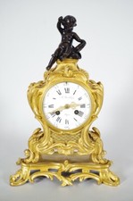 Pendule style Louis XV bronze