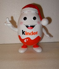 TIRELIRE PERSONNAGE PUB KINDER AVEC CHAPEAU DE NOEL