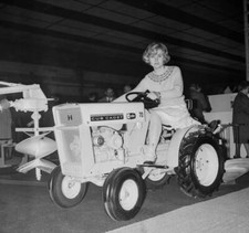 Michele Torr sits a tractor