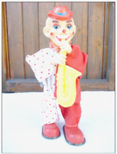 - RARE - Ancien automate clown jouant du saxo avec sa boite d'origine- jouet  -