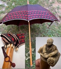 Ancien parapluie Japonais avec une house de sabre brodée